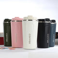 Insulated stainless steel travel mug, front view